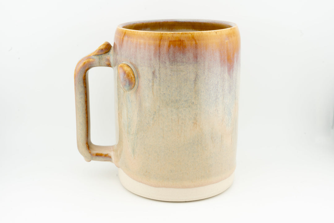 Ceramic stein mug, light cream glaze with caramel-brown rim and side handle