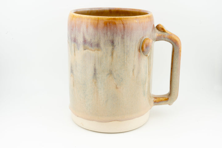 Ceramic stein mug in light cream with caramel-brown rim and side handle