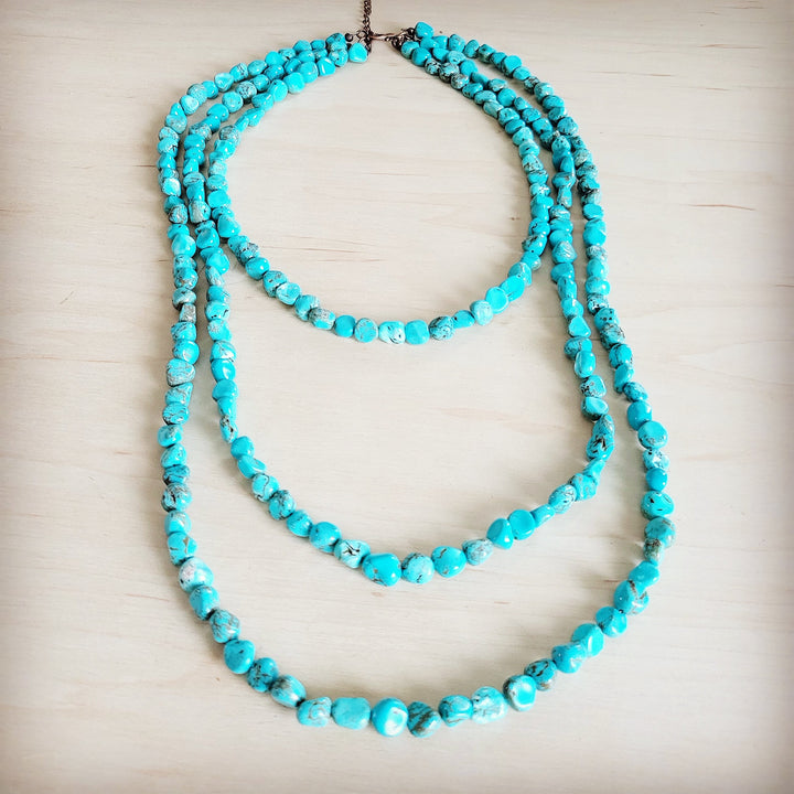 Turquoise triple-strand beaded necklace with small round beads and chain