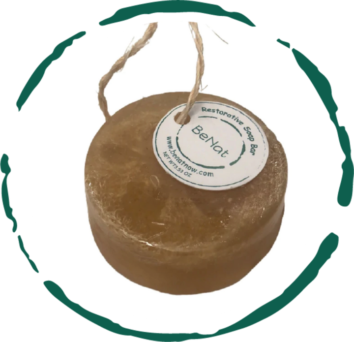 Round brown restorative soap bar with BeNat label and hanging rope loop