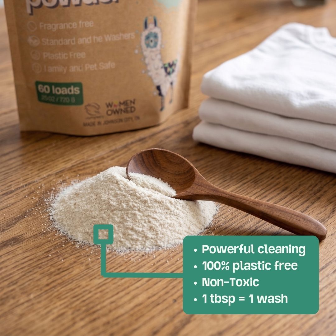 Fragrance-free laundry powder scoop with white powder and folded white towels