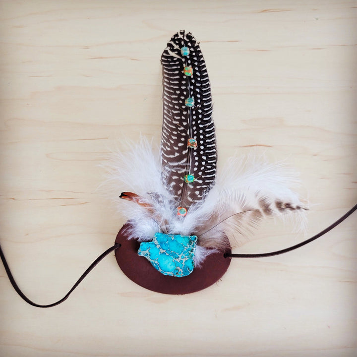 Embellished feather hat band with turquoise stone and white feather on black cord