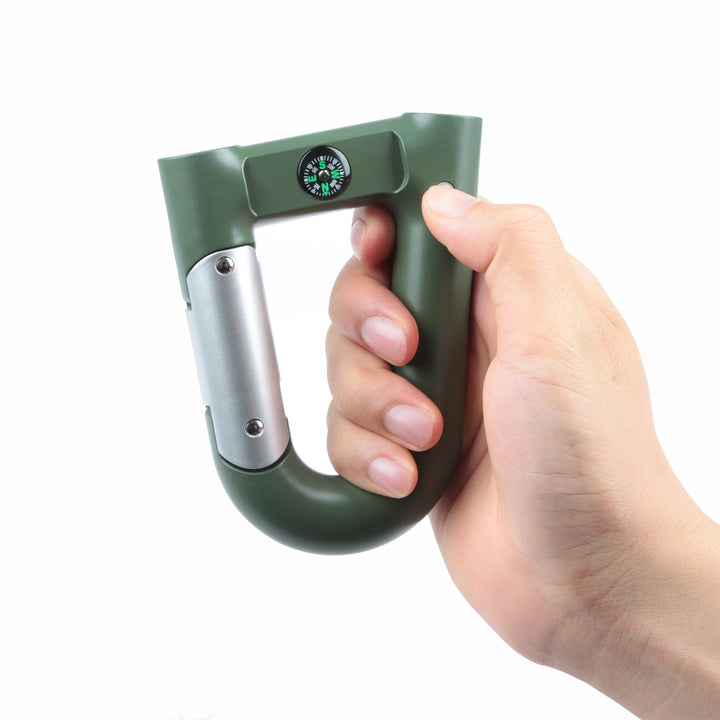 Green carabiner-shaped power bank held in hand with built-in compass dial