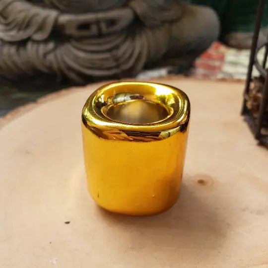 Gold ceramic candle holder with shiny metal rim, open top for tea light