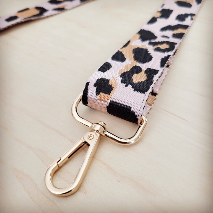 Close-up of leopard strap with gold-tone swivel lobster clasps