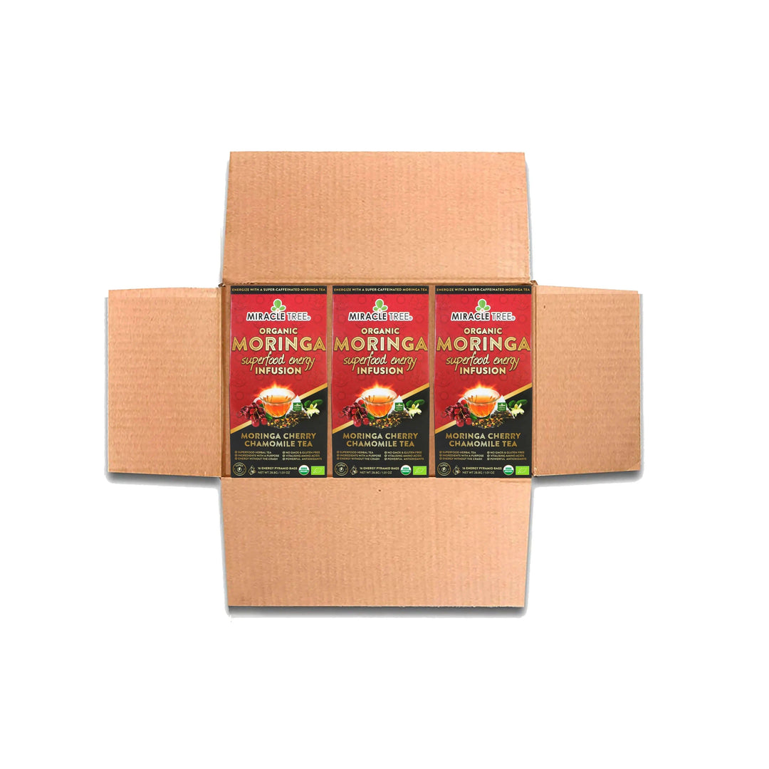 Cardboard shipping box containing multiple Miracle Tree organic moringa tea boxes