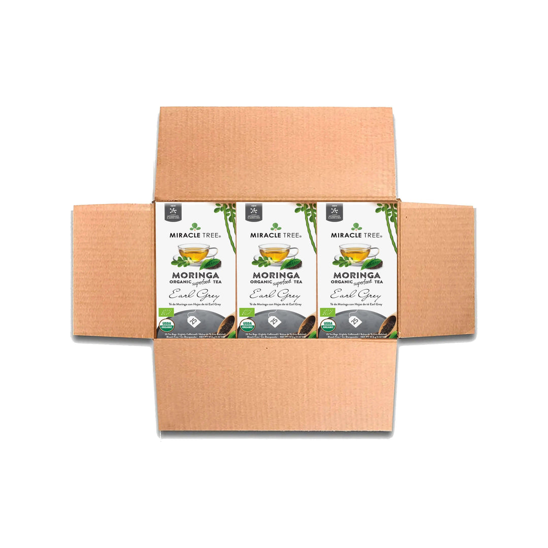 Tea box set with multiple organic moringa Earl Grey tea cartons in a cardboard carrier