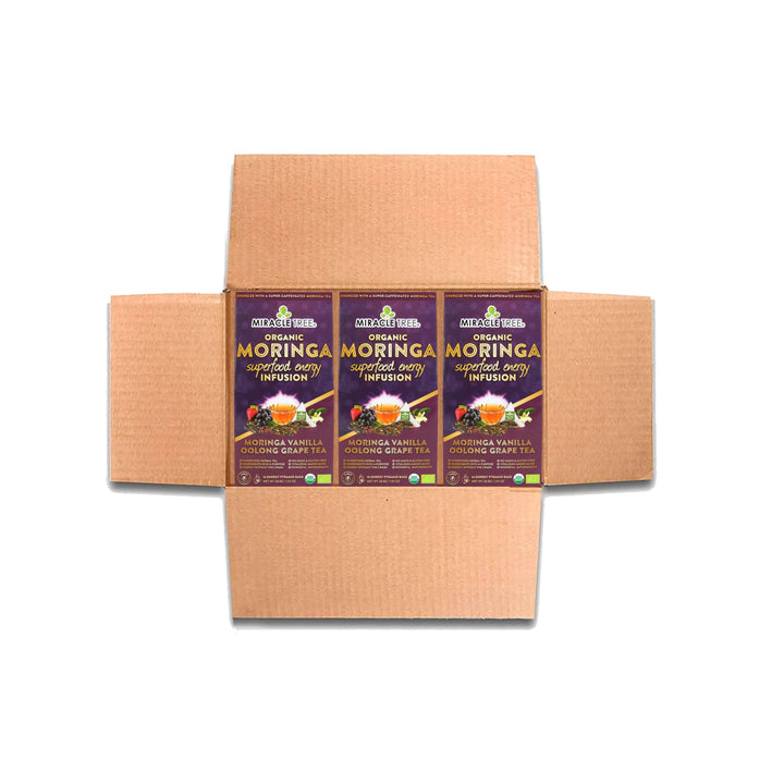 Multi-pack of Miracle Tree organic moringa tea boxes in brown shipping carton