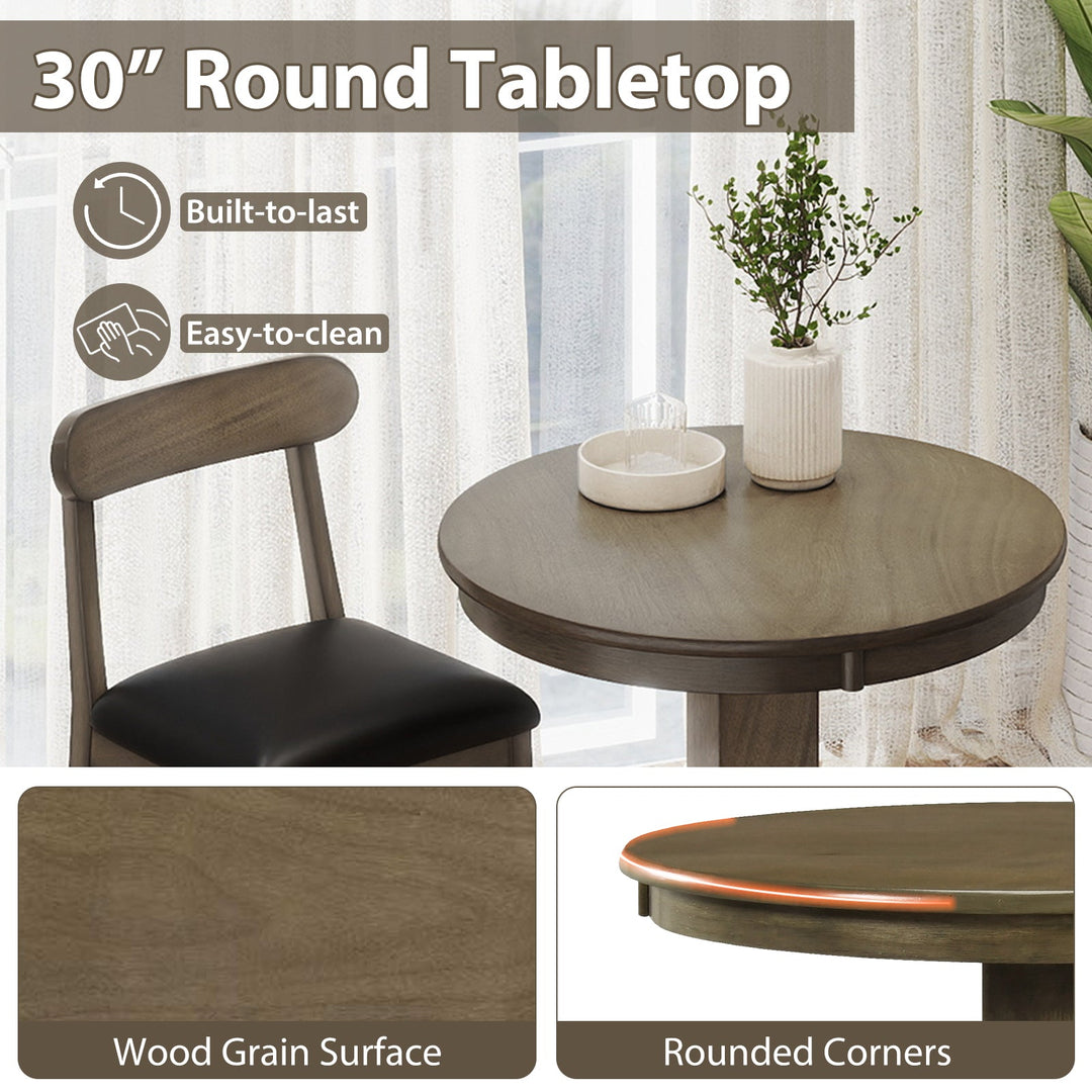 Round tabletop and stool seat close-up; dark wood grain surface and black cushions