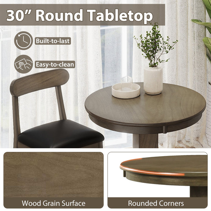 Round tabletop and stool seat close-up; dark wood grain surface and black cushions