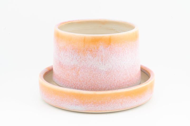 Tabletop planter set with drainage, peach-pink speckled glazed pot on matching tray.