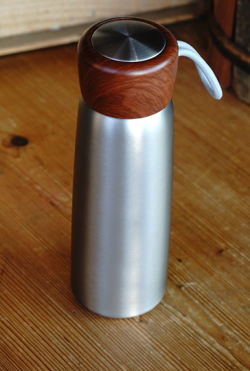 Stainless steel insulated tumbler with wooden lid and side carry loop
