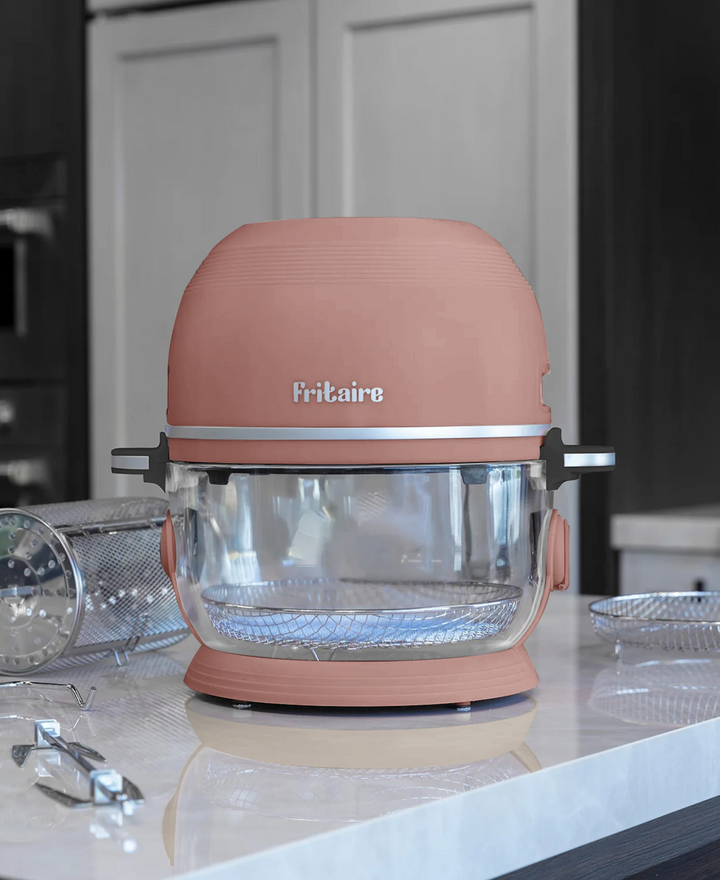 Mauve rose air fryer with clear glass bowl and cooking basket, lid closed