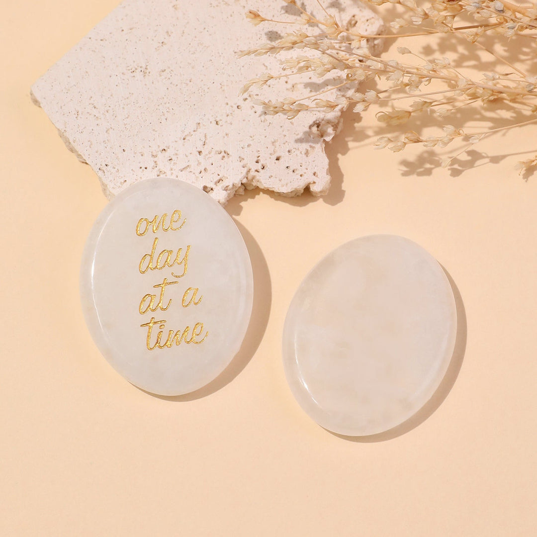 Pocket crystal stone with rose quartz color and gold "one day at a time" text