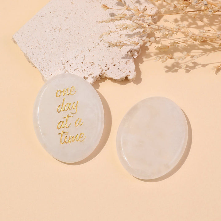 Pocket crystal stone with rose quartz color and gold "one day at a time" text