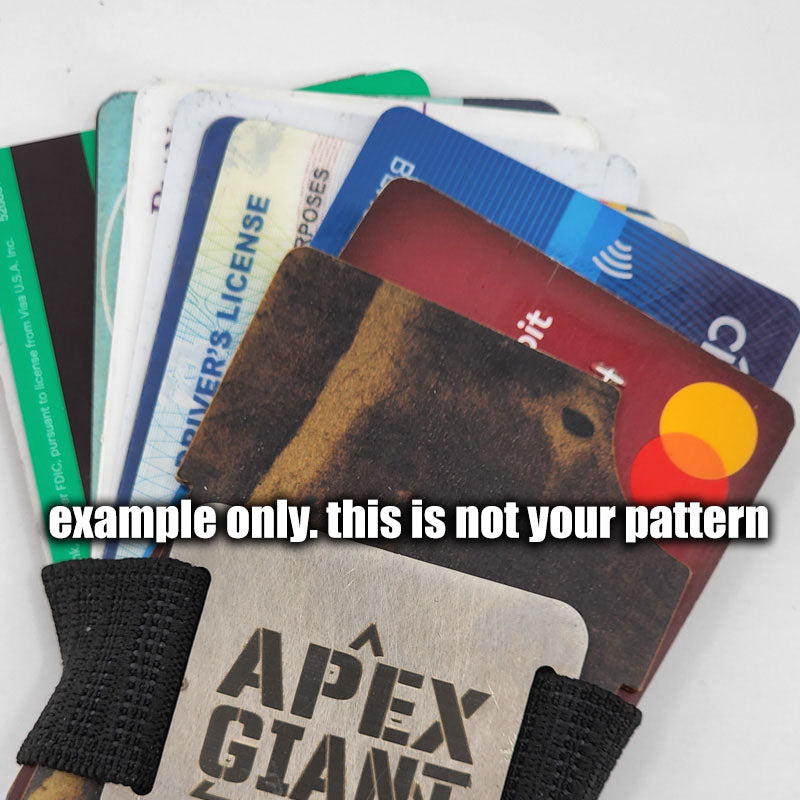 Minimalist card wallet with black elastic band securing a stack of mixed cards