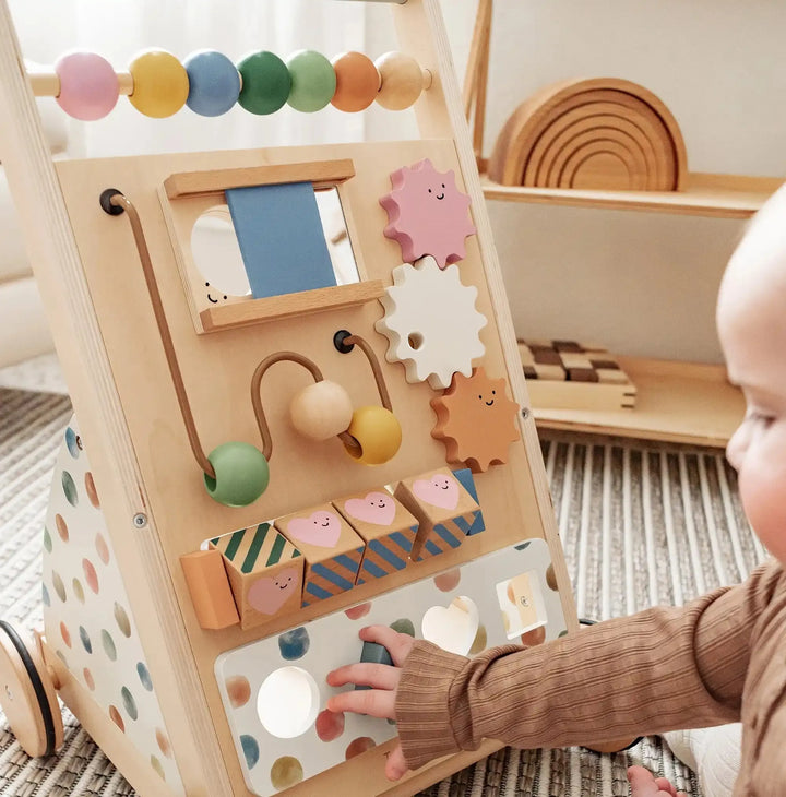 Natural wooden activity panel with bead track, gear pieces, and peg toy