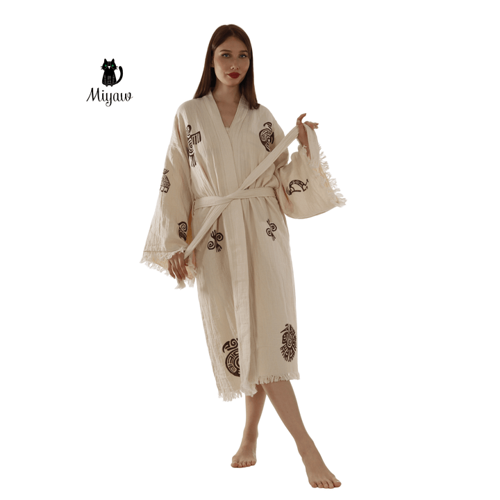 Beige cotton kimono-style bathrobe with Aztec motifs, belt tie, fringe trim