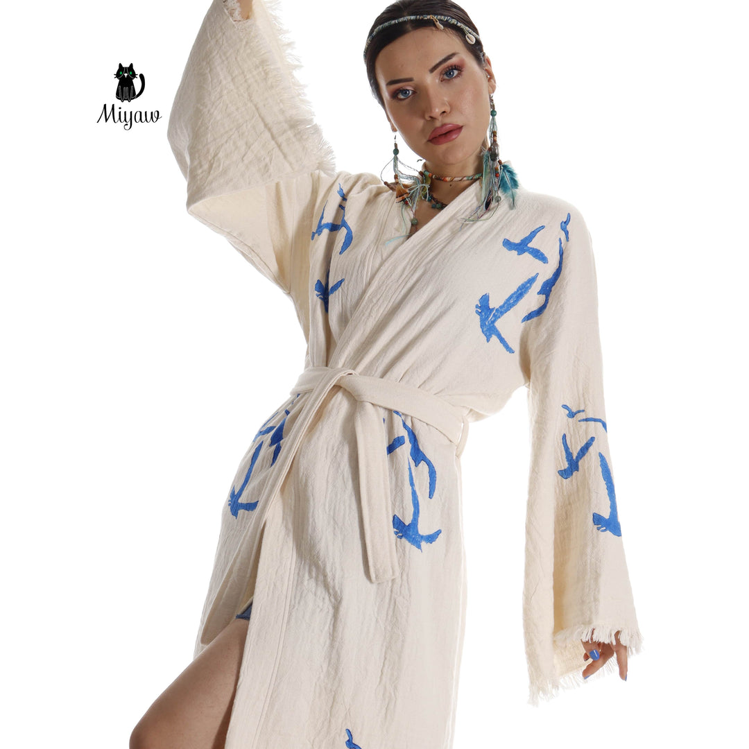 Beige seagull-print kimono robe detail with tied waist and fringe cuff trim