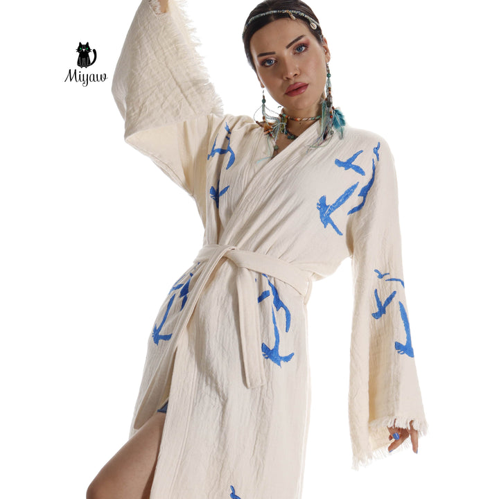 Beige seagull-print kimono robe detail with tied waist and fringe cuff trim