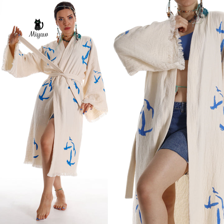 Beige seagull-print kimono robe with tied belt, open front, tassel trim on sleeves