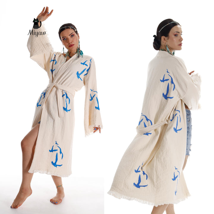 Seagull-print kimono robe in beige with blue birds, tied waist belt, fringe cuffs and hem