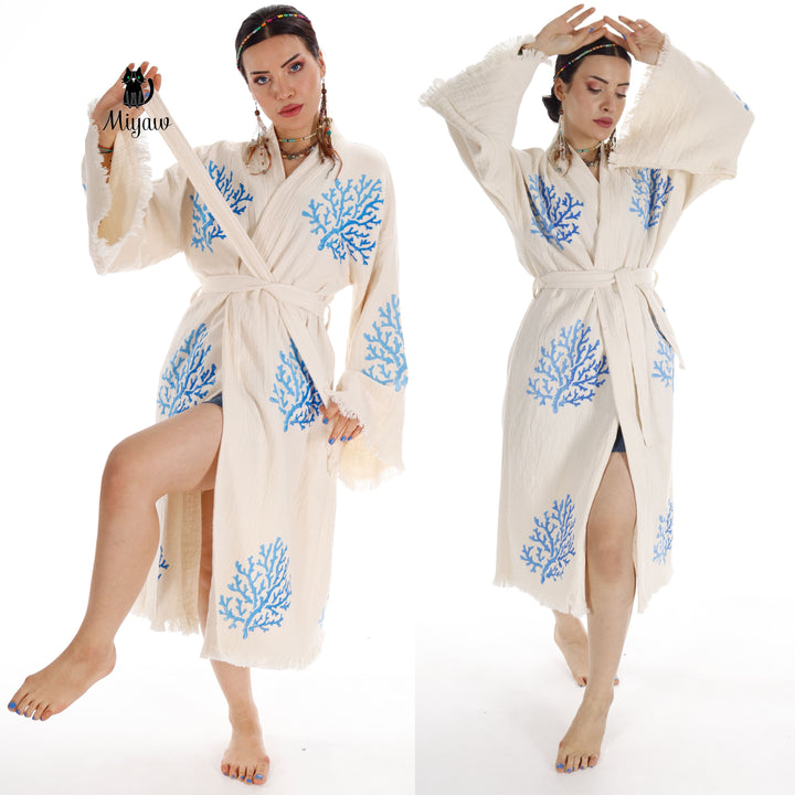 Beige organic cotton kimono with blue coral tree embroidery, waist tie and fringe hem