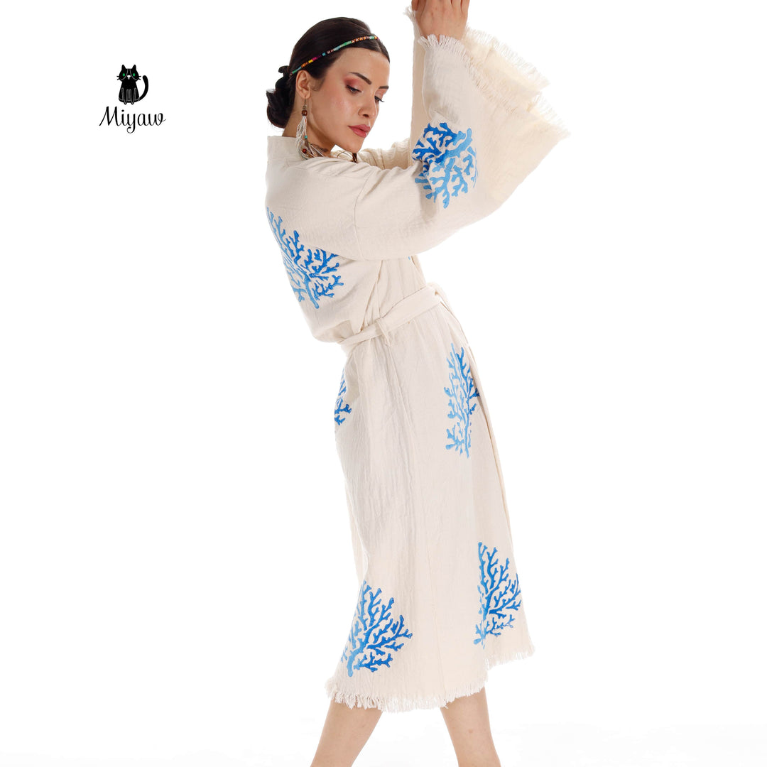 Beige organic cotton kimono with blue coral tree embroidery, waist tie and flowing fringe hem