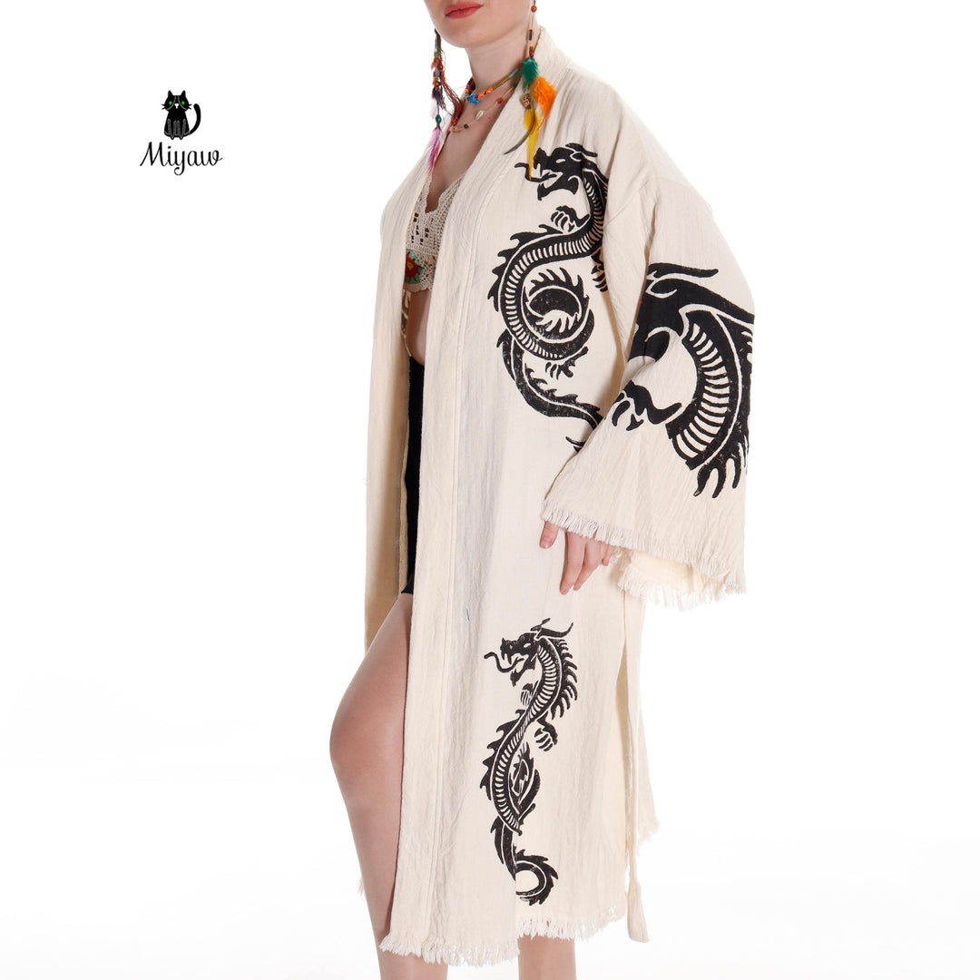 Beige cotton kimono robe with black dragon pattern, open front and fringed sleeve ends