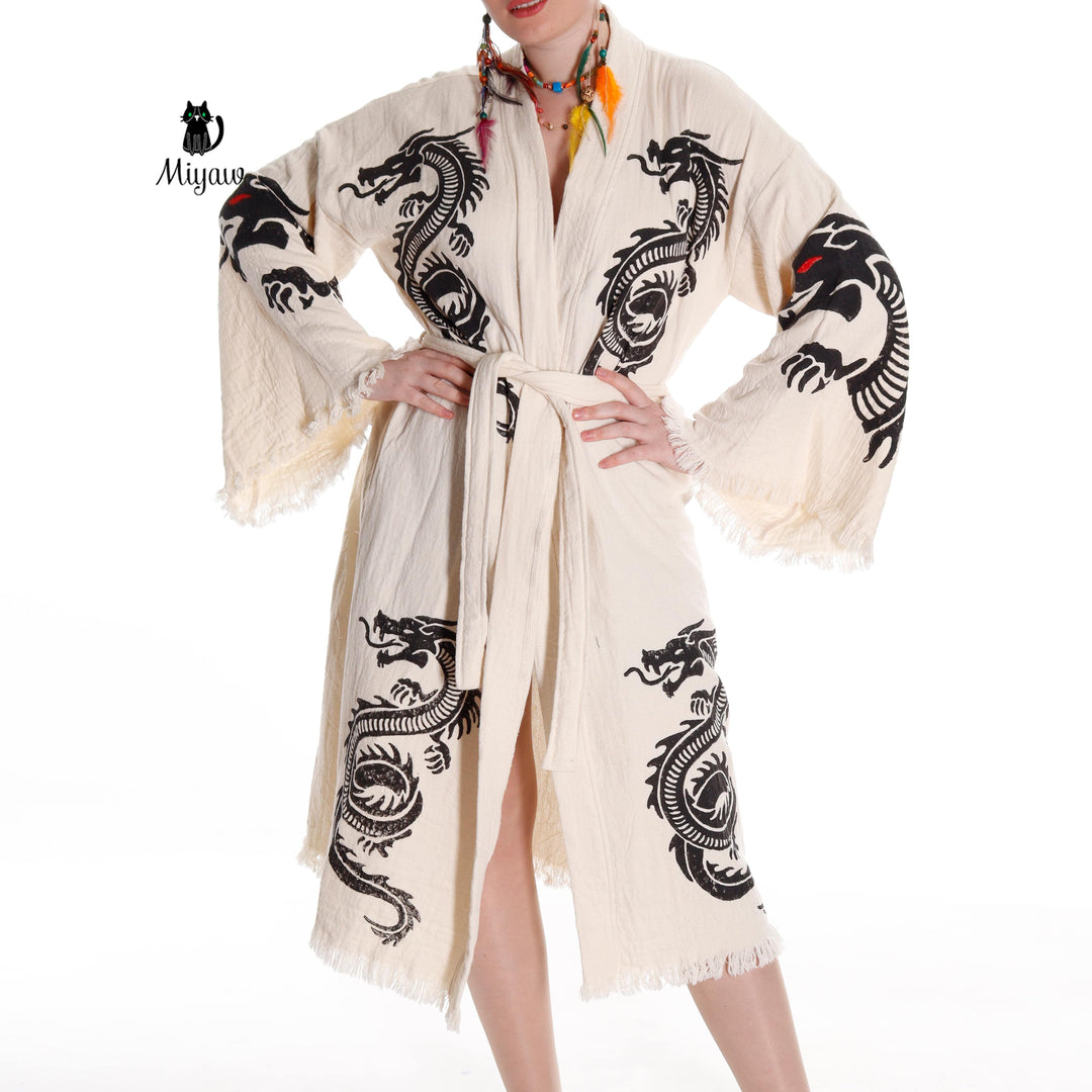 Beige women's cotton robe with black dragon print, belt tie center and tasselled hem