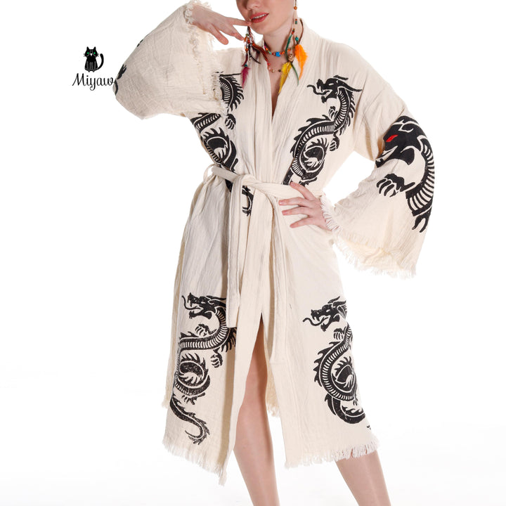 Beige cotton bath robe with black dragon motifs, long sleeves, and tie waist