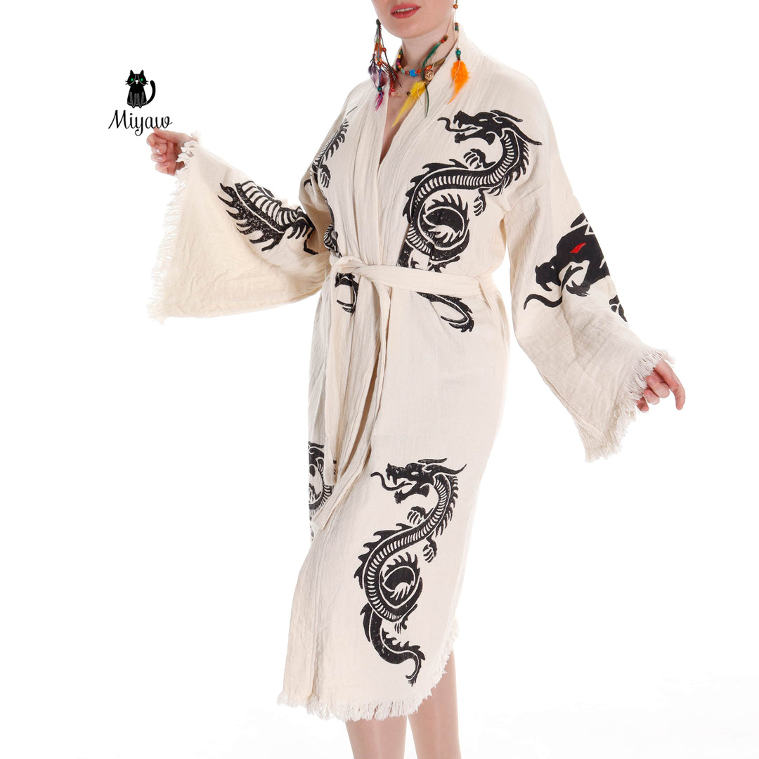 Beige kimono-style cotton robe with black dragon motif, self-tie waist and tassel trim