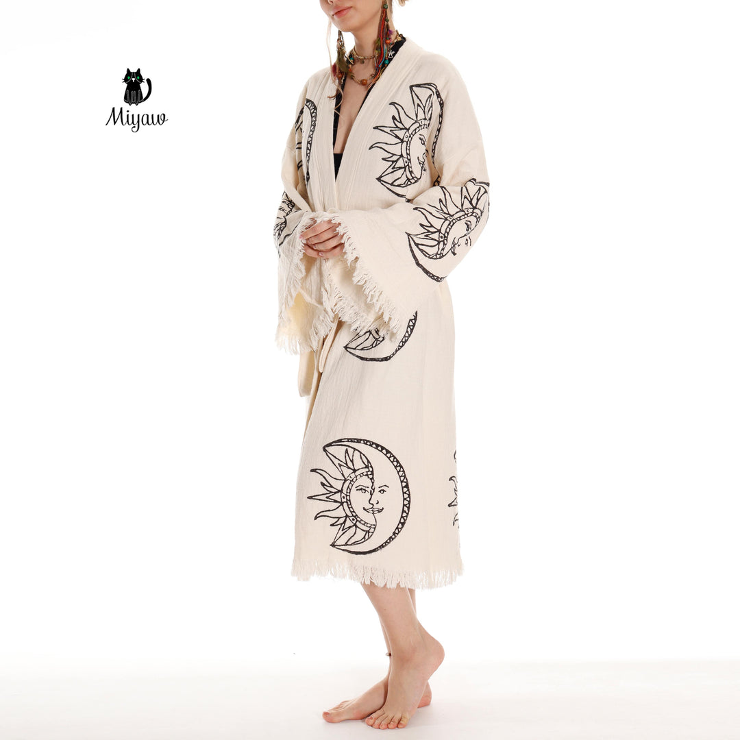 Beige organic cotton kimono robe with moon-and-sun face print, open V neckline, belt tie