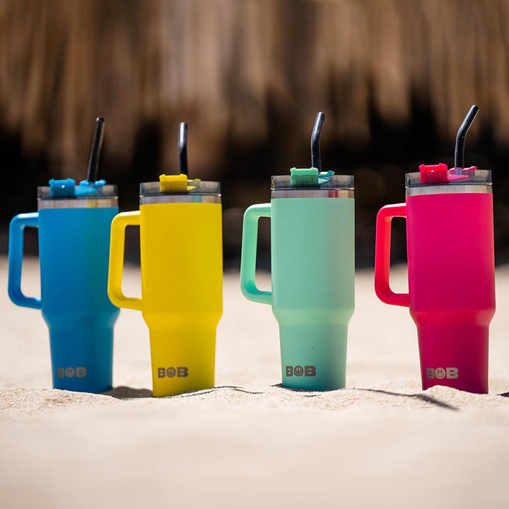 Colorful set of four 40oz tumblers with black lids and bend straws