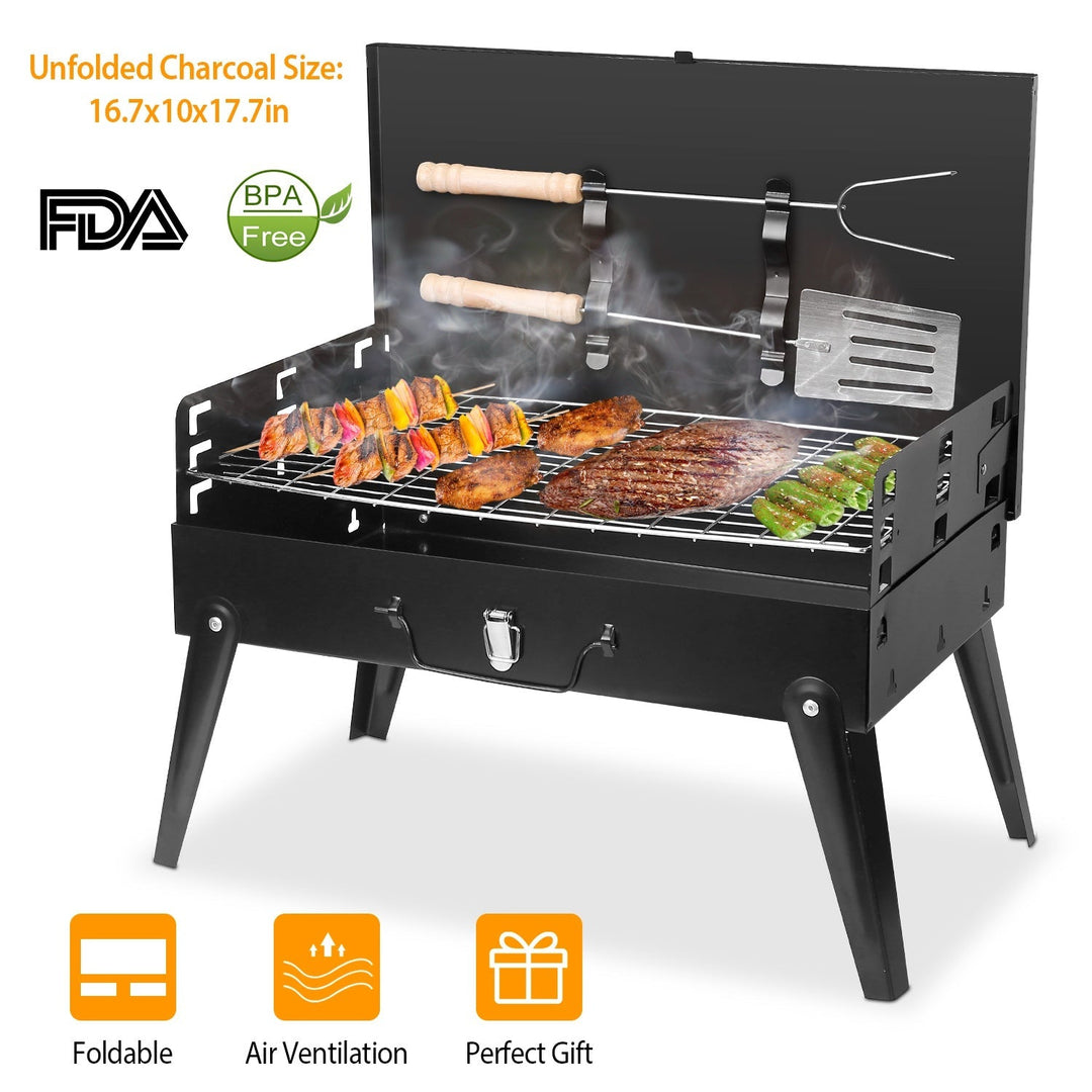 Black portable charcoal grill with skewers, ash drawer, and side shelf