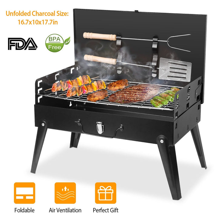 Black portable charcoal grill with skewers, ash drawer, and side shelf