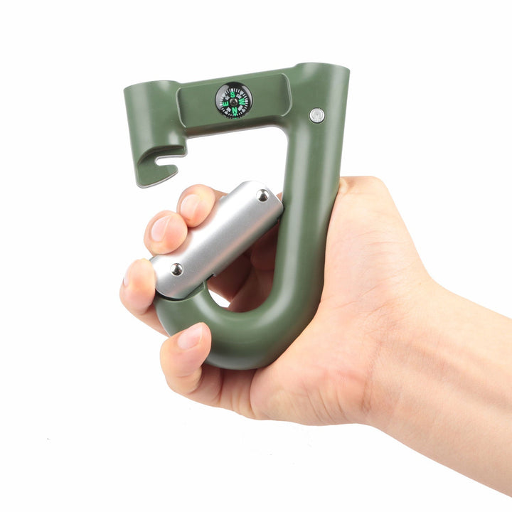 Green carabiner power bank in hand with silver flashlight latch and compass dial