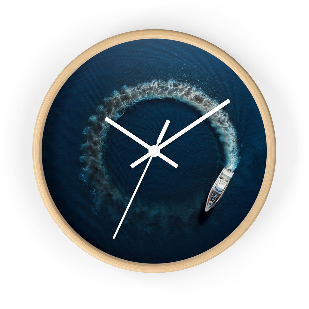 Round wall clock with blue nautical artwork, wooden rim, white clock hands