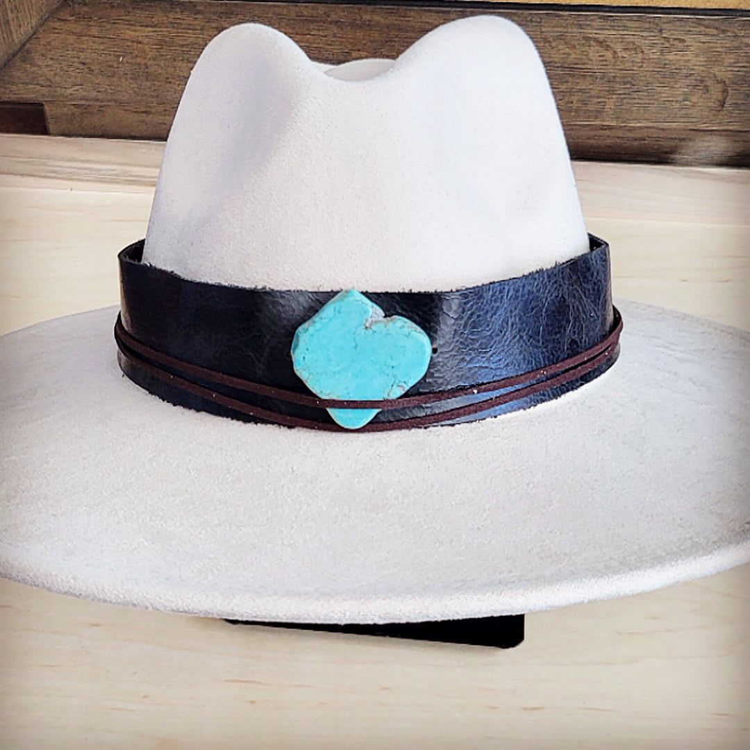 White felt wide-brim hat with dark leather band and turquoise heart centerpiece