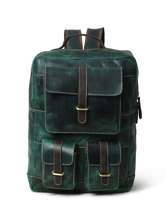 Green leather backpack with front flap pocket, stitched panels, and metal strap details.