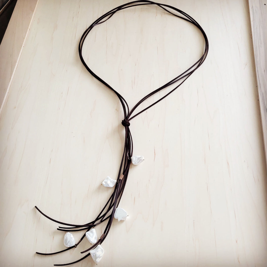 Dark brown leather cord necklace with knotted center and white pearl fringe