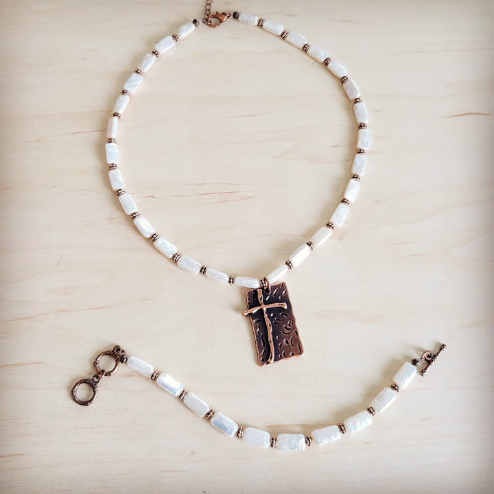 Freshwater pearl beaded necklace with copper-tone cross pendant and chain extender
