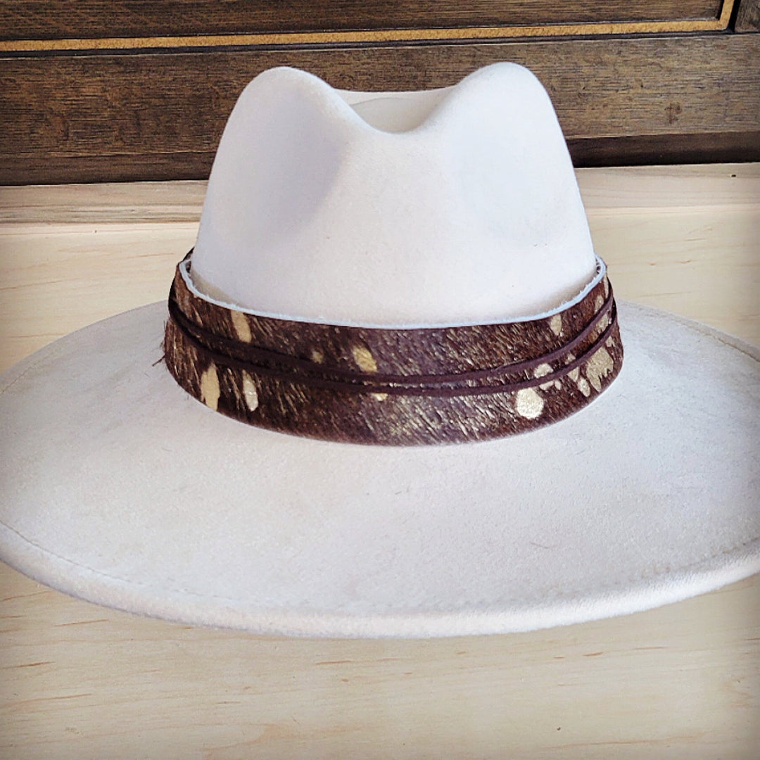 White wide-brim felt hat with brown metallic-speckled hair-hide band at crown