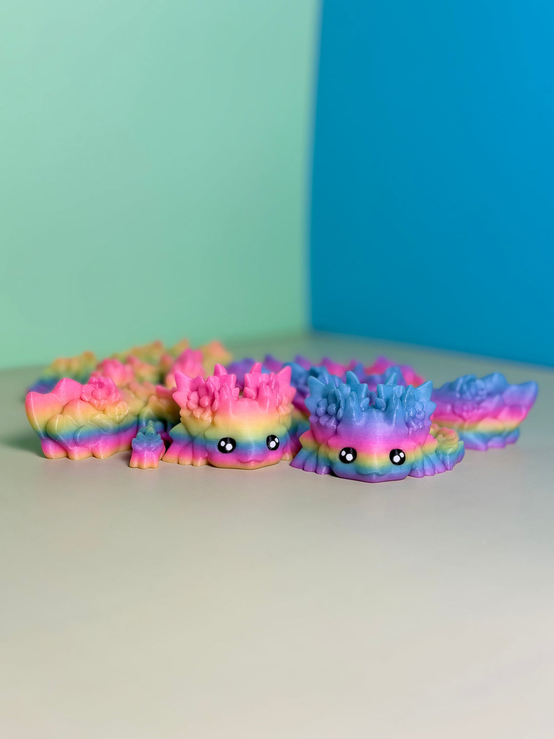 Rainbow axolotl dragon plush with wings and spiky fins, multicolor soft fabric