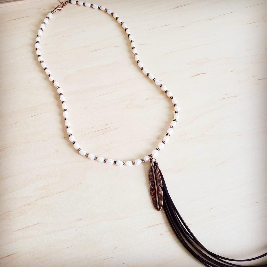 Long pearl and copper bead necklace with bronze feather tassel pendant