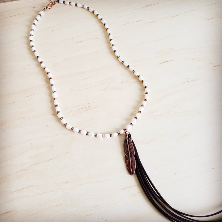 Long pearl and copper bead necklace with bronze feather tassel pendant