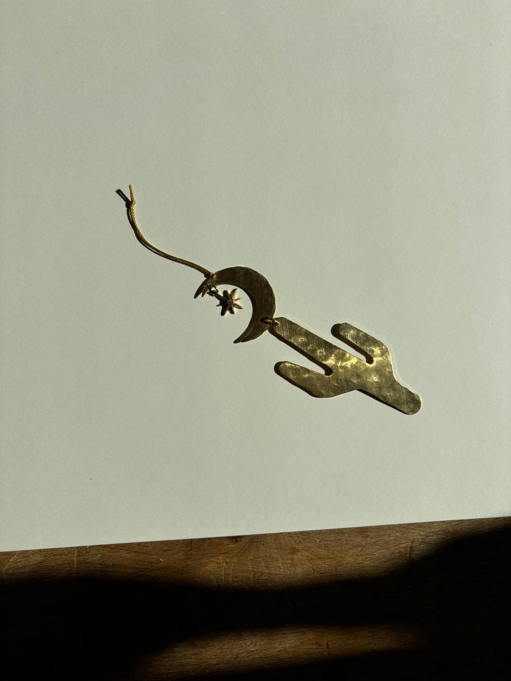 Dark gold-tone crescent moon star ornament with hanging loop