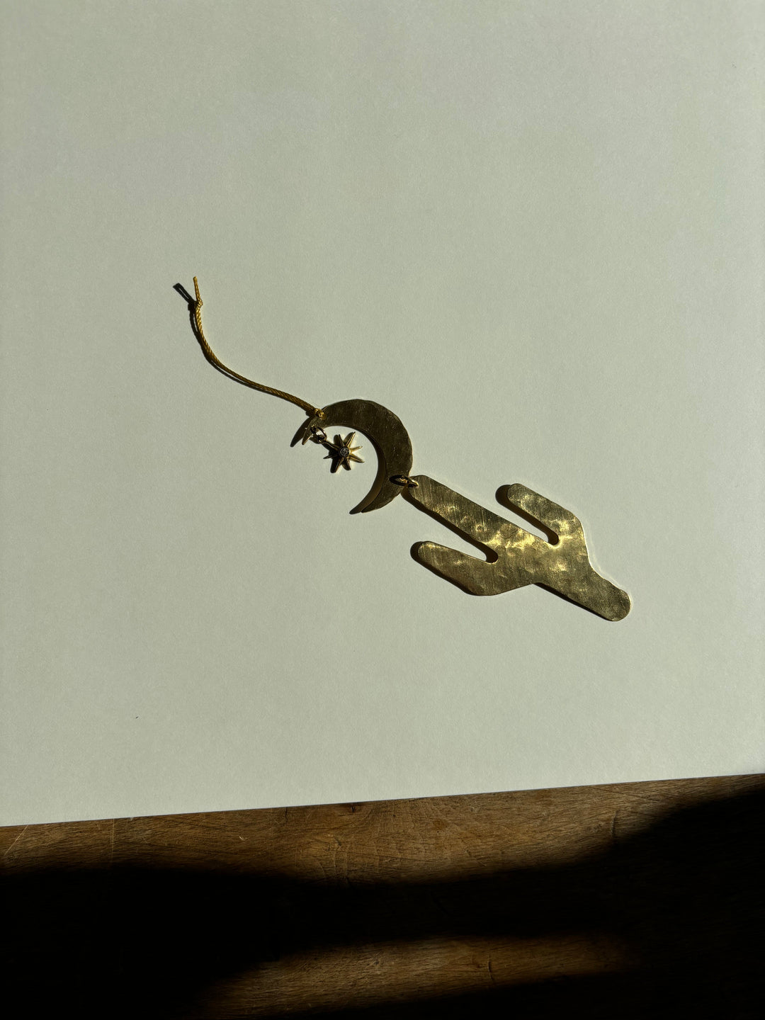 Dark gold-tone crescent moon star ornament with hanging loop