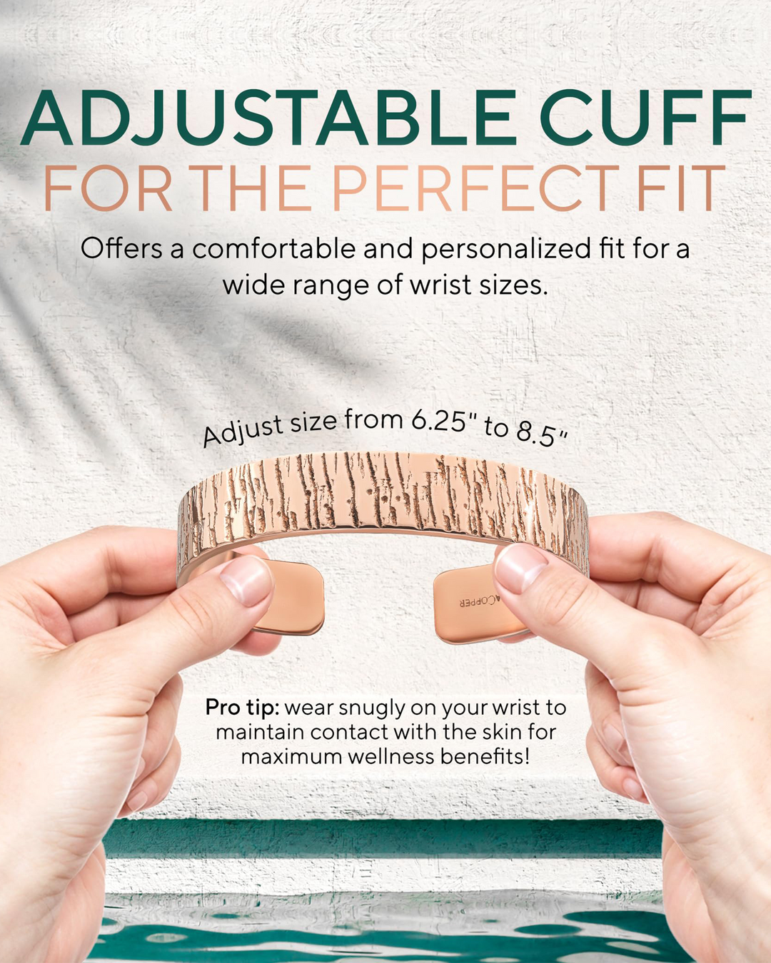 Adjustable copper cuff bracelet held in hands, hammered texture wide band.