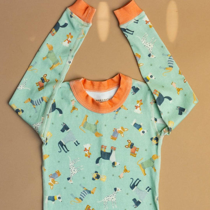 Teal pajama set with orange crew neck and playful dogs-and-animals print, long sleeves